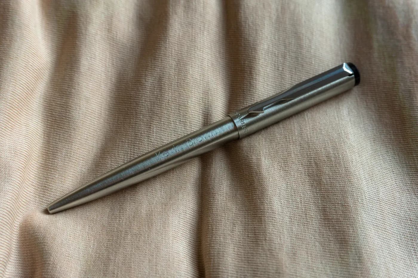 A Parker Vector stainless-steel ballpoint pen, shown as a signing reference