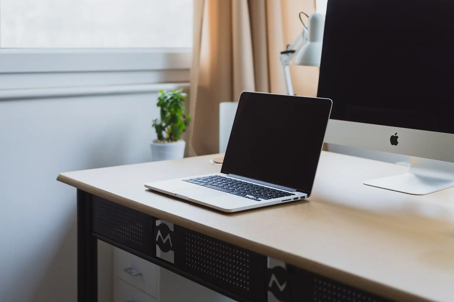 Laptop and stationery on a neat desk