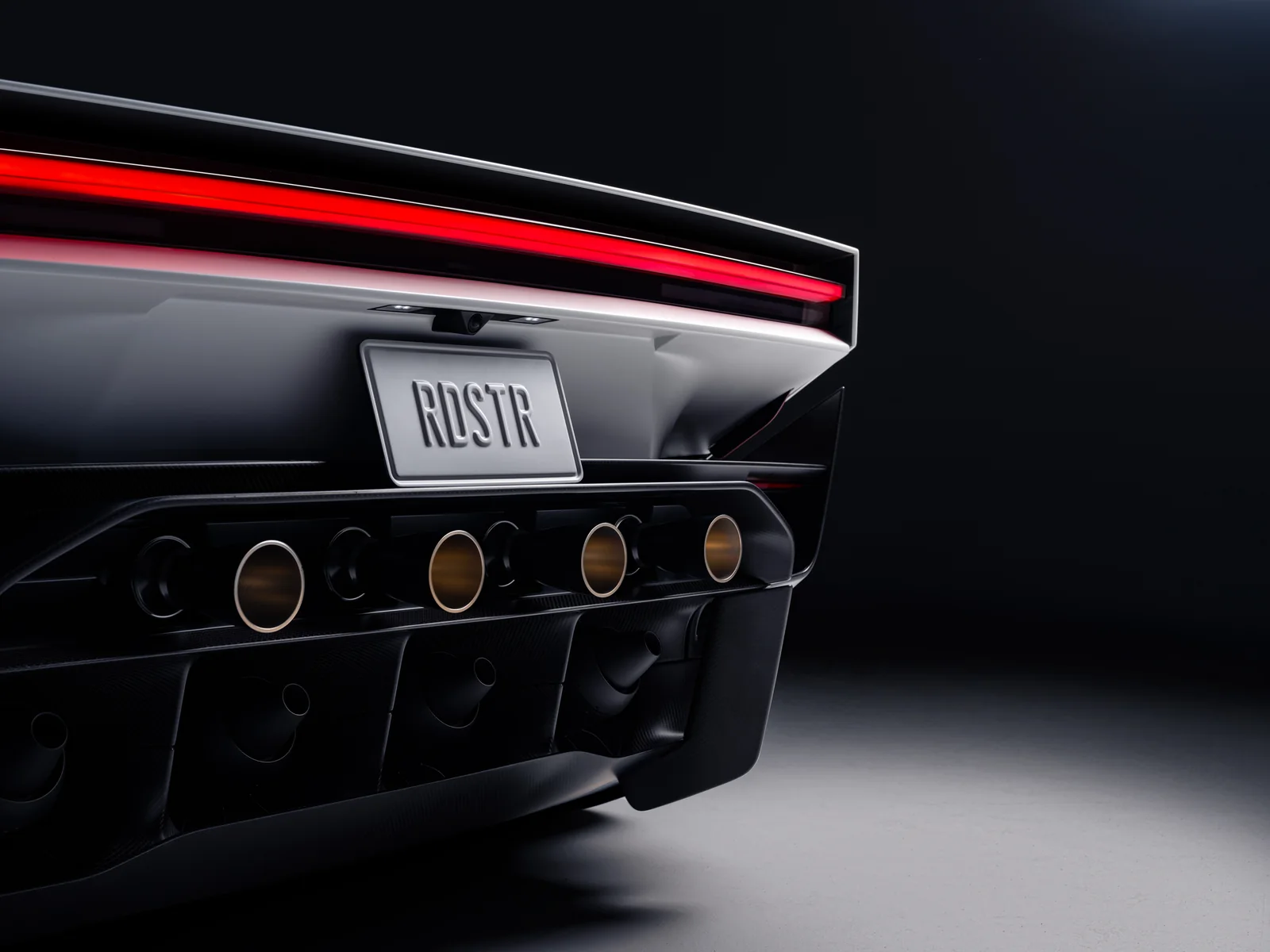 Rear detail of the new Tesla Roadster showing the taillight and nozzle arrangement