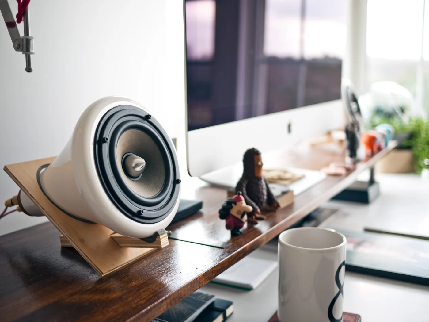A computer and music player on an office desk