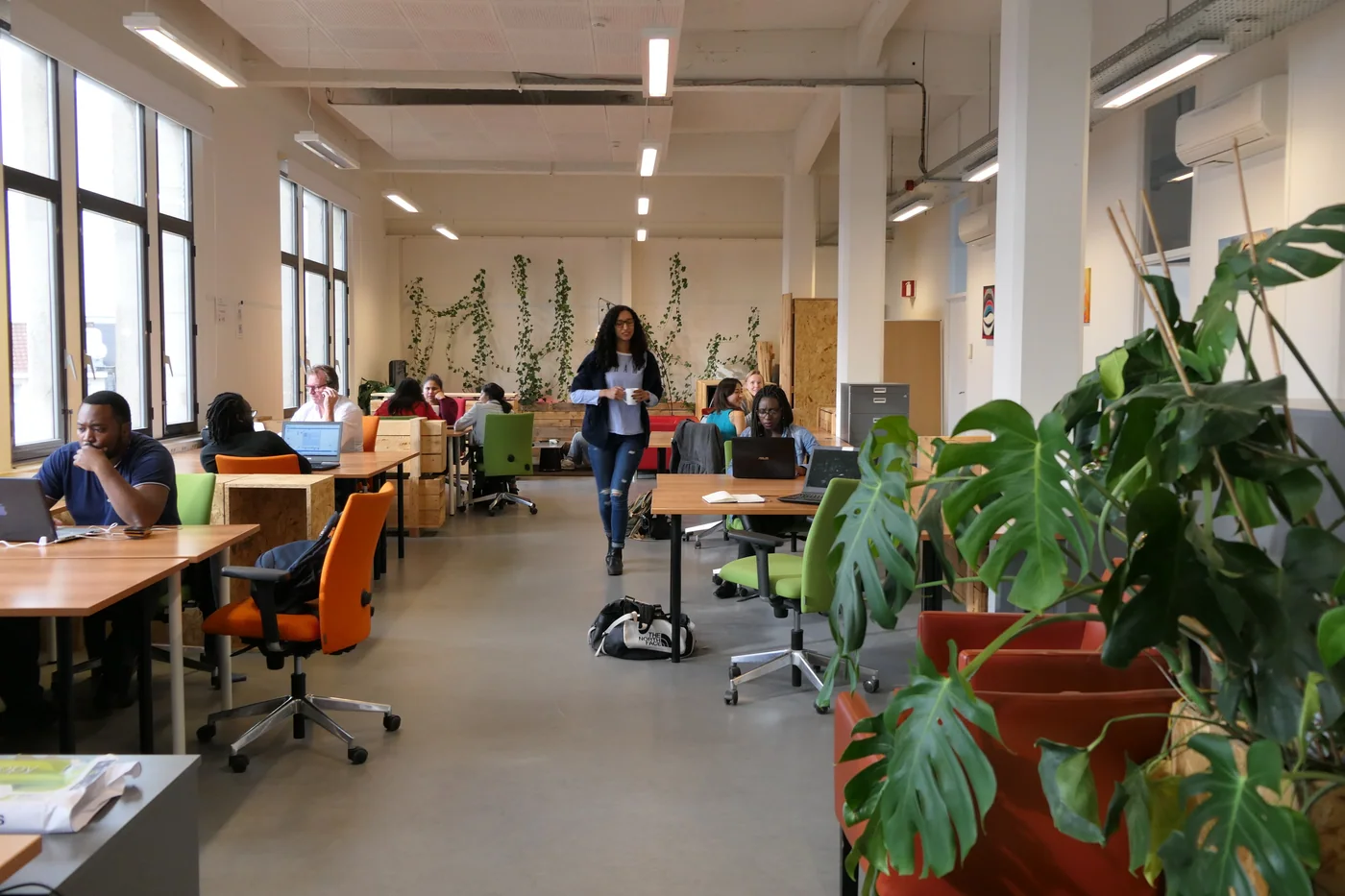 A shared coworking interior, shown as a service-business workspace reference