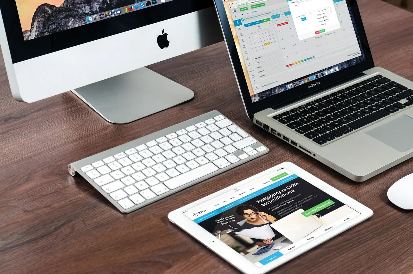 A paperless desk with several digital devices