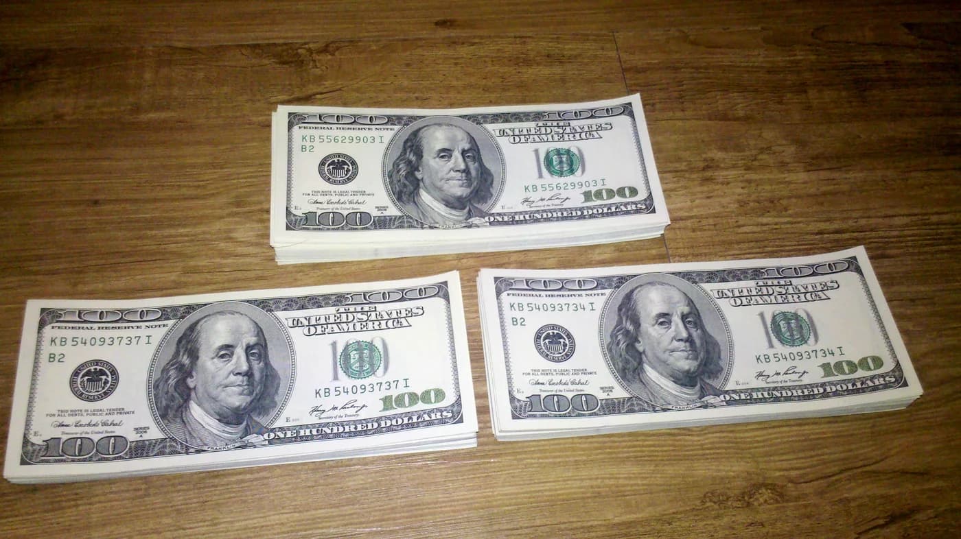 Reference photograph of United States currency arranged on a surface