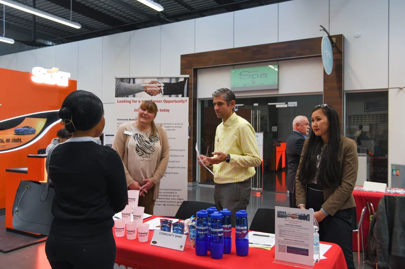 Archival reference photograph of employers and job seekers at a community job fair
