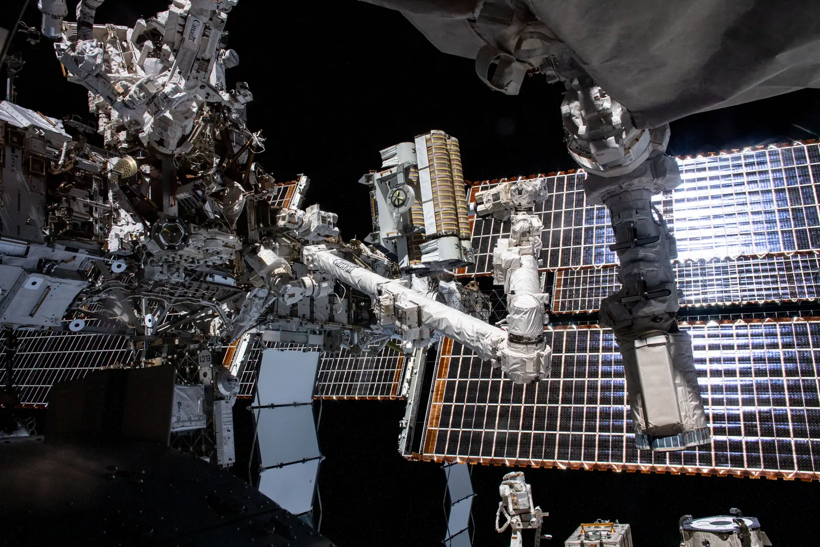 A roll-out solar array being deployed at the International Space Station
