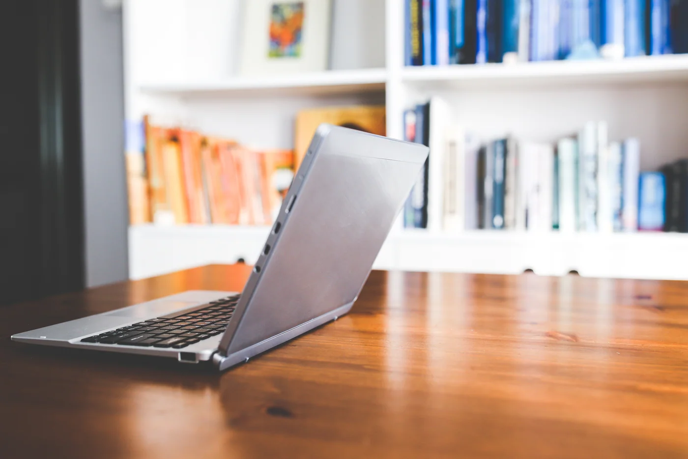 Reference photograph of a laptop in a working space