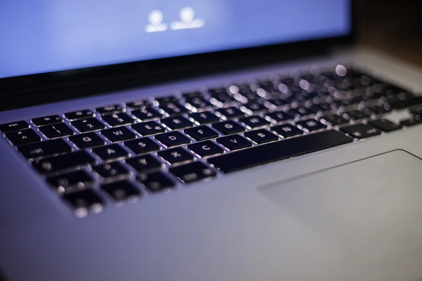 Backlit laptop keyboard, shown as a software-maintenance reference