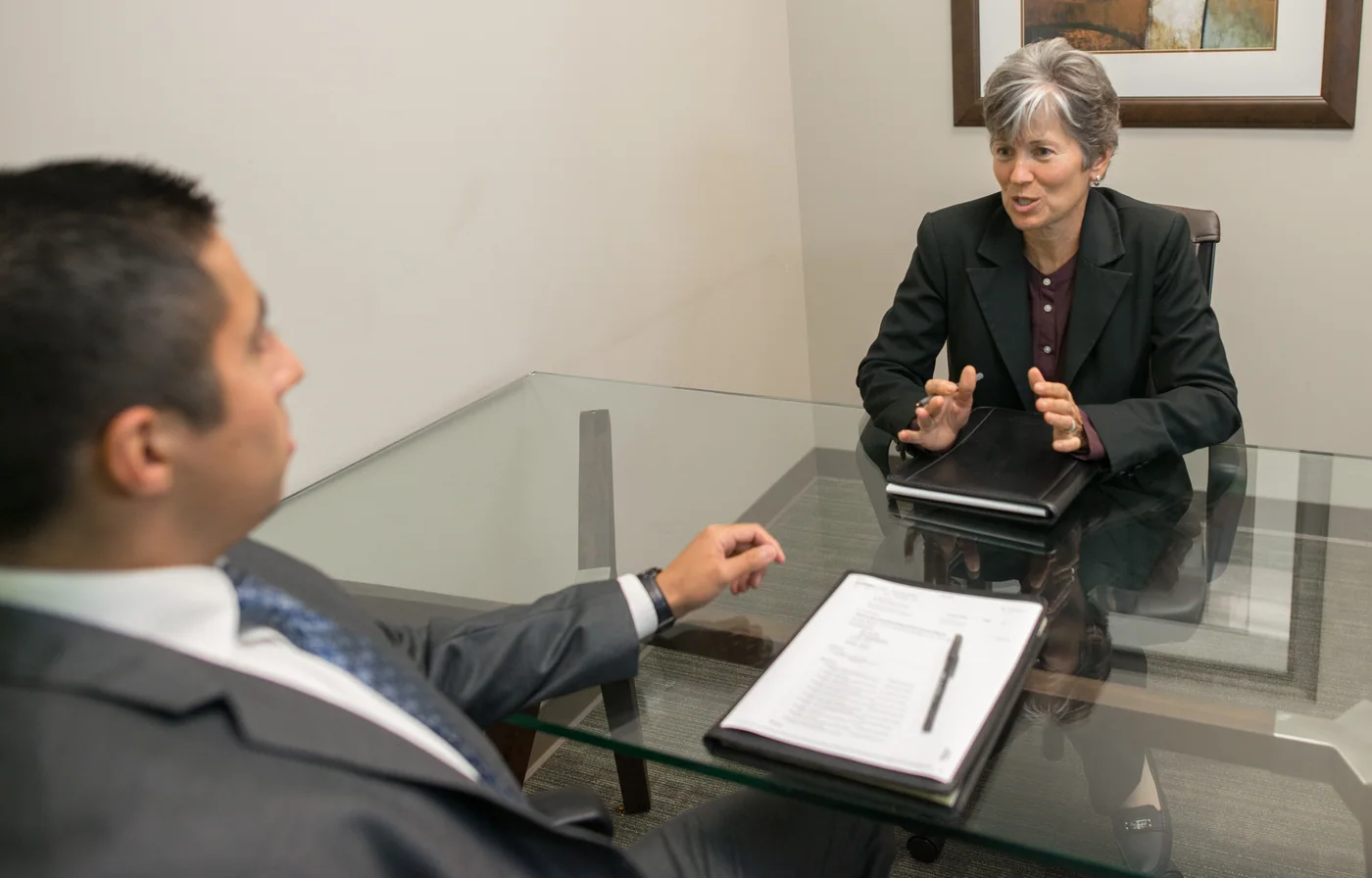 An interview in an office, shown as an employee-onboarding reference