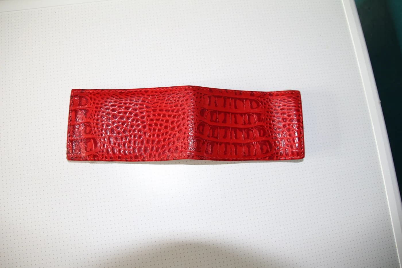 Red leather card holder, shown as a personal-finance reference