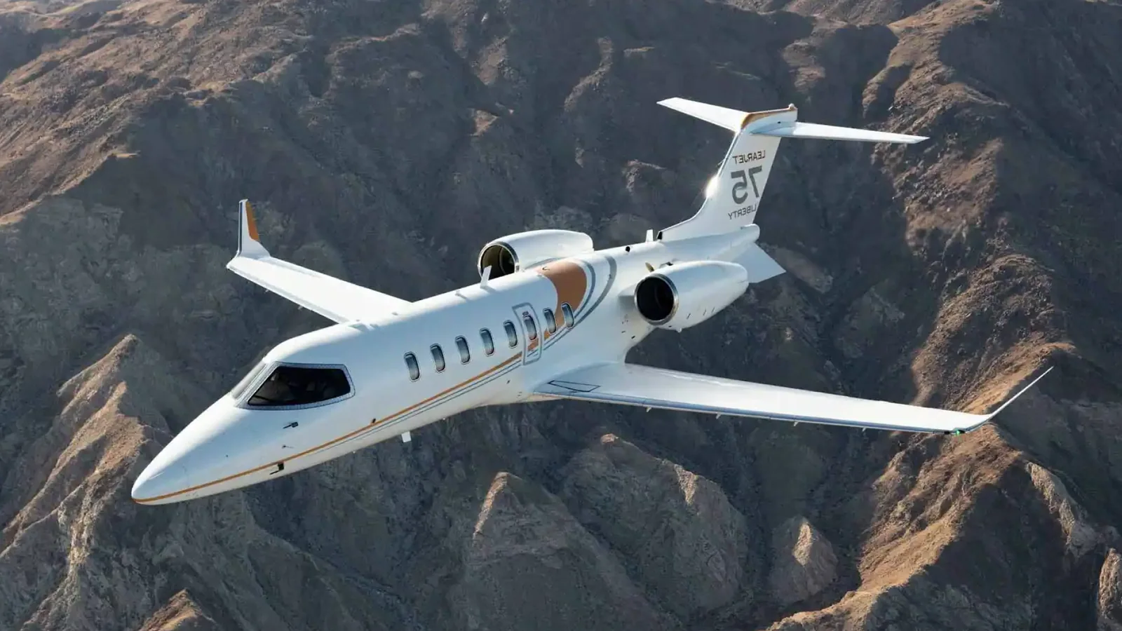 Private aircraft above mountainous terrain, as pictured in Jet.Live’s aircraft guide